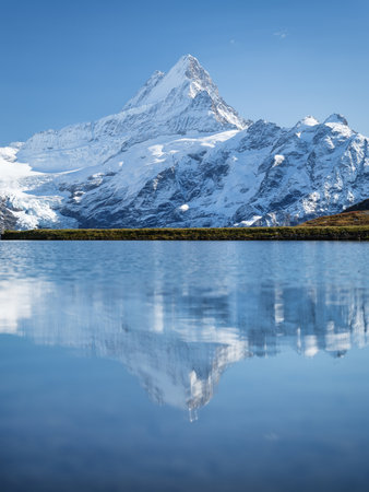 High mountains and reflection on the surface of the lake. Mountain valley with lake. Landscape in the highlands in the summertime. Photo in high resolution.の写真素材
