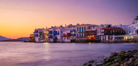 Mykonos, Greece. View of a traditional house in Mykonos. The area of Little Venice. Seascape during sunset. Sea shore and beach. Photo for travel and vacation.の写真素材