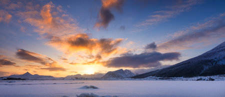 Panoramic view of the sunset sky. Winter landscape. The Lofoten Islands, Norway. High resolution photo.の写真素材