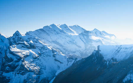 Mountain scenery in the Swiss Alps. Mountains peaks. Natural landscape. Mountain range and clear blue sky. Landscape in the summertime. Large resolution photo.の写真素材