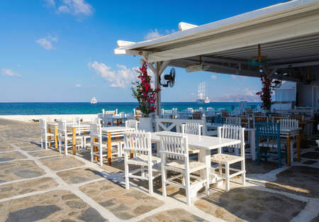 A restaurant overlooking Little Venice, Mykonos Island, Greece. Lunch and dinner overlooking the sea. Photo as wallpaper.の写真素材