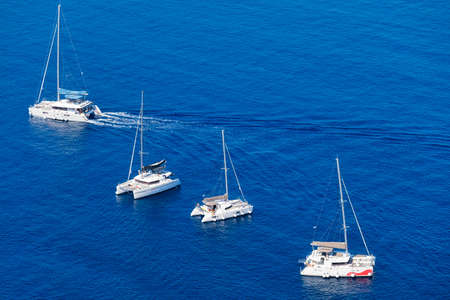 Yacht on the water surface from top view. Turquoise water background from top view. Summer seascape...