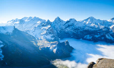 Mountain scenery in the Swiss Alps. Mountains peaks. Natural landscape. Mountain range and clear blue sky. Landscape in the summertime.の写真素材
