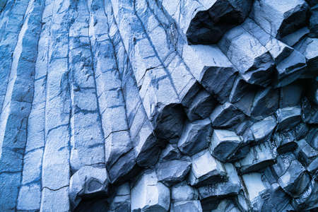 Basalt stones as a background. Reynisfjara Beach, Iceland. Sharp rocks. Photography for design. Textures in nature.の写真素材