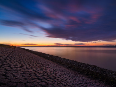 A seaside sunset during sunset. A long exposure photo. Landscape during a bright sundown. The sea...
