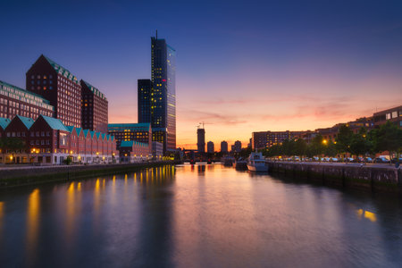 Rotterdam, Netherlands. View of the city center. Cove and pier for boats and ships. Panoramic view. Cityscape in the evening. Skyscrapers and buildings.の写真素材