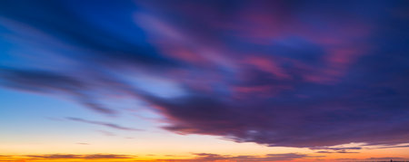 Sky with clouds during sunset. Clouds and blue sky. A high-resolution photograph. Panoramic photo for design and background.の写真素材