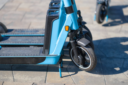 Eletro scooter on the street. Eco-friendly mode of transport. Transport for rent to move around the city. Modern technology.の写真素材