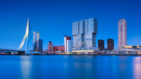 Rotterdam, Holland. View of the Erasmus Bridge and the city center. Panoramic view. Cityscape in the evening. Skyscrapers and buildings.の写真素材