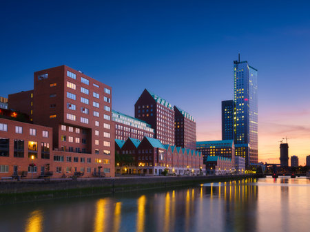 Rotterdam, Netherlands. View of the city center. Cove and pier for boats and ships. Panoramic view. Cityscape in the evening. Skyscrapers and buildings.の写真素材