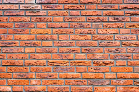 Brick wall as a background. Old brick on a retro house. Abstract composition for the design. Photo...