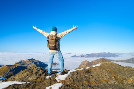 Tourist with a backpack in the mountains. Mountain hiking in the high mountains. Travel and adventure background. Active life. Landscape in the summer time.の写真素材