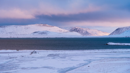 Panoramic views of mountains in Iceland. Strong winds. Wild scenery and dark during the storm. A view of Iceland's nature in winter time.の写真素材