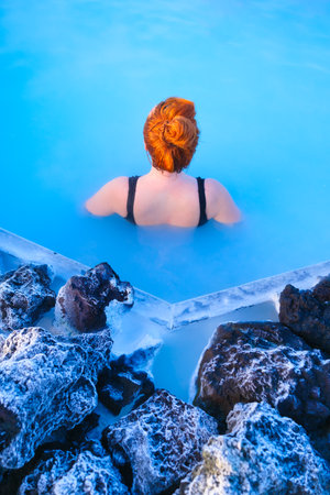 Iceland. Relaxation at the spa in Iceland. Skin Ñare. Healthy Lifestyle. Warm springs of natural origin. Blue lake and steam.の写真素材