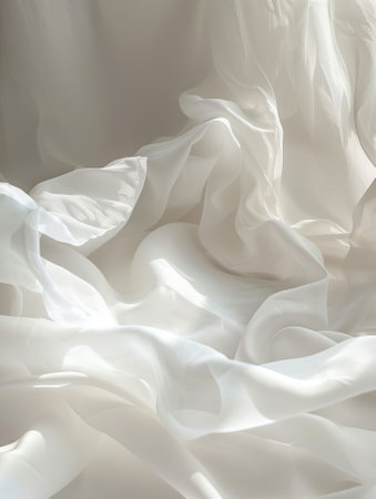 Closeup of rippled white silk fabric on white background.の素材