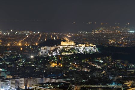 Acropolis in Athens with the city lights as background. Night view.の写真素材