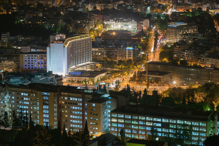 Athens, Greece 4 November 2015. Night motion blurred traffic in Athens against the city lights.のeditorial素材