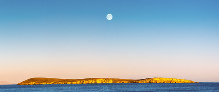 Drionisi at Paros island in Greece dusk hour with full moon.の写真素材