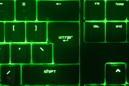 Green keyboard. Technology gaming gadget.