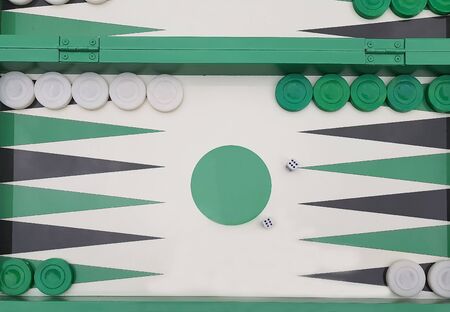 Top view of a backgammon with a pair of dices.