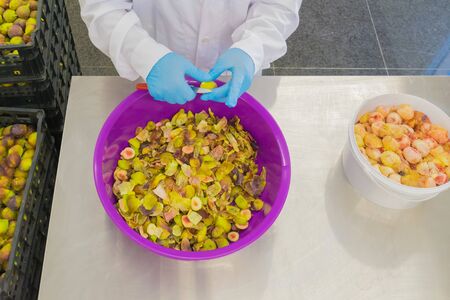 Cleaning the outer of a fig for marmalade.