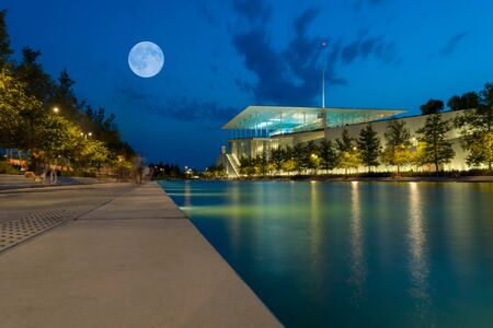 Athens, Greece 9 September 2017. Full moon at Stavros Niarchos building.