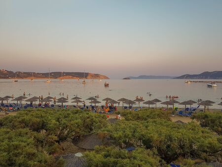 Methoni, Greece 9 August 2017. People enjoying their time at Methoni beach in Peloponnese in Greece during sunset.のeditorial素材