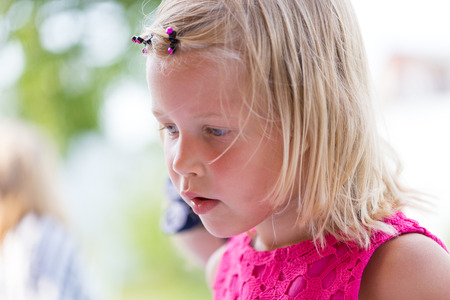 portrait of thoughtful little girlの写真素材