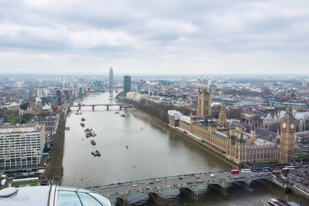 This is a skyline photo of London featuring the Houses of Parliament and Westminster Bridge. This is a view from the London Eye.の写真素材