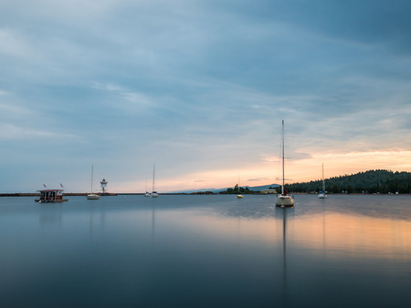 These are sailboats on the harbor during sunset. This is in Grand Marais. This is in the Lake Superior North Shore area of Minnesota.の写真素材