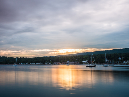 These are sailboats on the harbor during sunset. This is in Grand Marais. This is in the Lake Superior North Shore area of Minnesota.の写真素材