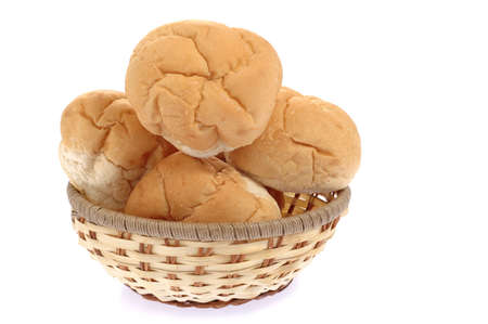 Basket full of fresh baked dinner rolls.の写真素材