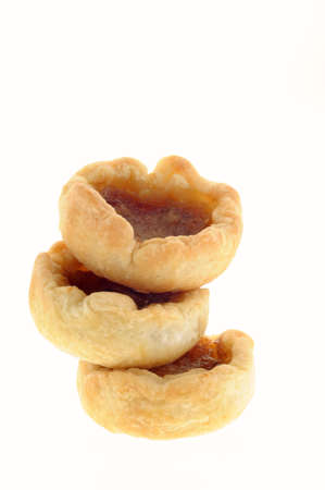 Delicious fresh homemade butter tarts isolated on white.の写真素材