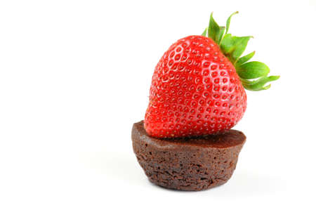 Fresh baked chocolate brownie and ripe strawberry.の写真素材