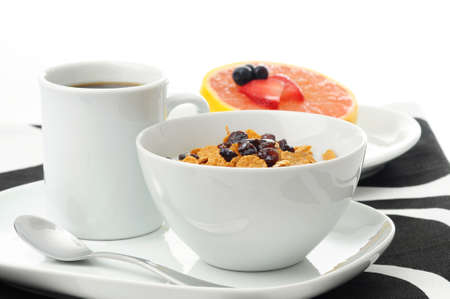 Bowl of high fiber cereal with raisins and grapefruit.の写真素材
