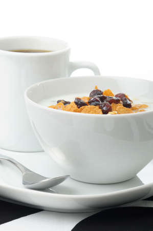 Bowl of healthy high fiber cereal with coffee.