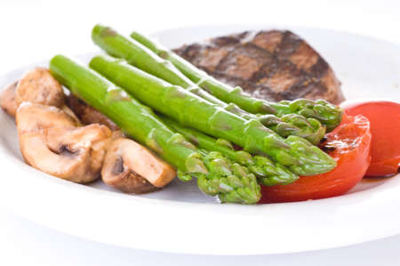 Fresh cooked asparagus accompanies a delicious meal.の写真素材