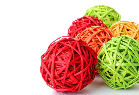 Bold and colorful woven wicker spheres for a background.の写真素材