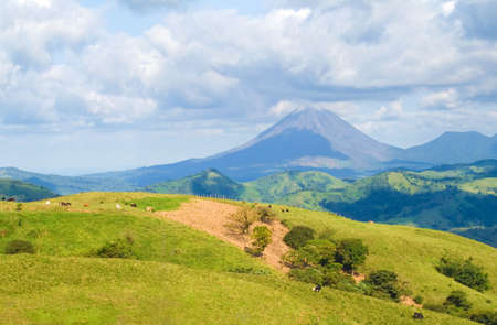 Landscape showing Costa Rica pastureland with Arenal Volcano in the background.の写真素材