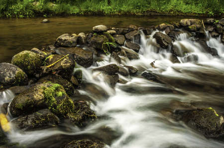 Rock dam in a small stream in Costa Rica.の写真素材