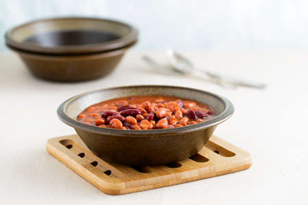 Hearty bowl of slow baked beans in a sauce.の写真素材