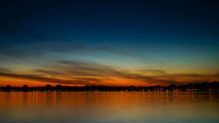 Sunset over Kempenfelt Bay and the City of Barrie Ontario skyline.の写真素材