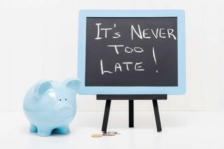 Blue porcelain piggy bank with a message.  Concept of saving no matter your age.