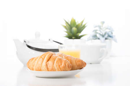 Delicate croissants presented in a breakfast type setting.の写真素材