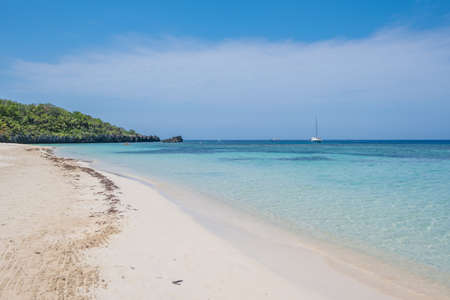 Beautiful beach and warm crystal clear water of West Bay Roatan Honduras.の写真素材