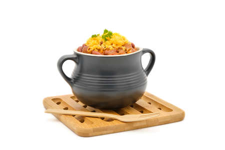 Bowl of delicious homemade chili topped with grated cheddar cheese photographed on a white background with copy space.の写真素材