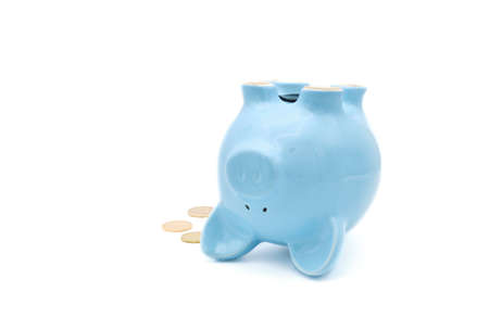 Ceramic piggy bank laying on its back useful for poor or failing economy concept.
