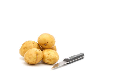 Fresh whole white potatoes photographed on a white background with ample copy space.の写真素材