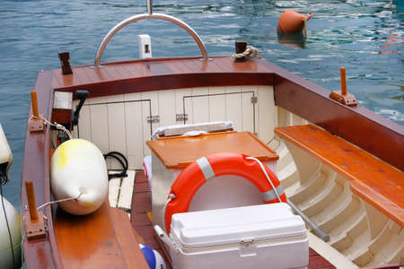 Lifebuoy orange in boat. Concept rescue on water in summer.の写真素材