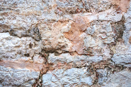 Light colour old stone wall background texture.の写真素材